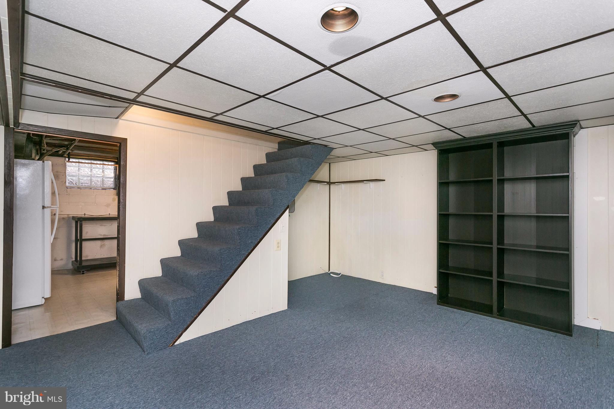 708 Arncliffe Road Baltimore, MD 21221 - Photo 22 of 30 a view of an empty room with a staircase
