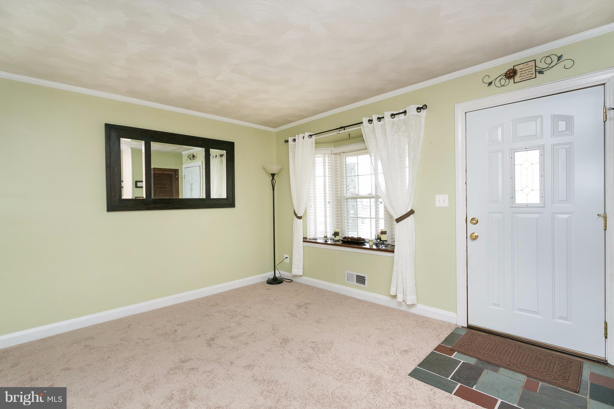 708 Arncliffe Road Baltimore, MD 21221 - Photo 5 of 30 a view of an empty room with a window