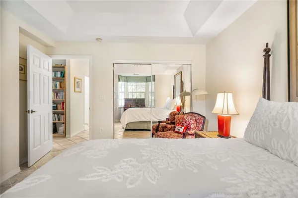 a bedroom with a bed and a couch