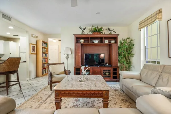 a living room with furniture a fireplace and a table