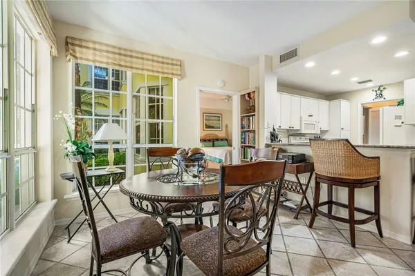 a view of a dining room with furniture and a window