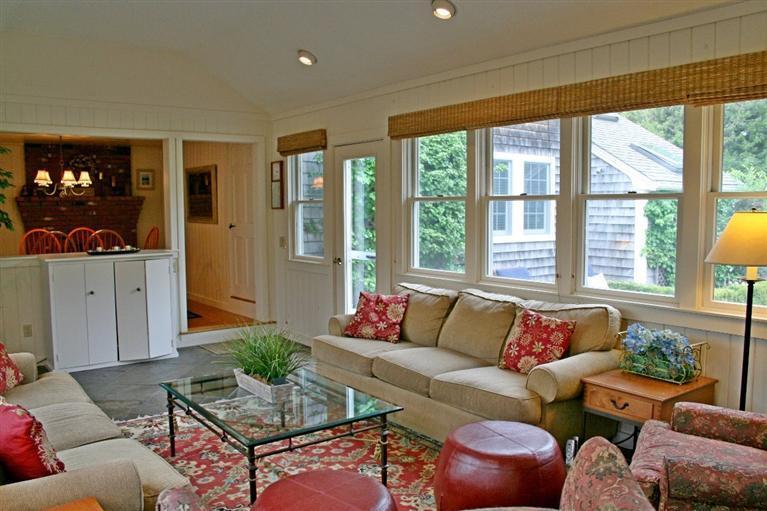 45 Gibson Road Orleans, MA 02653 - Photo 13 of 33 a living room with furniture and floor to ceiling windows