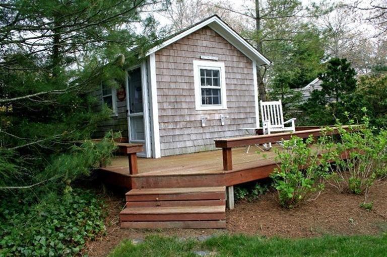 45 Gibson Road Orleans, MA 02653 - Photo 16 of 33 a view of backyard with plants and outdoor seating