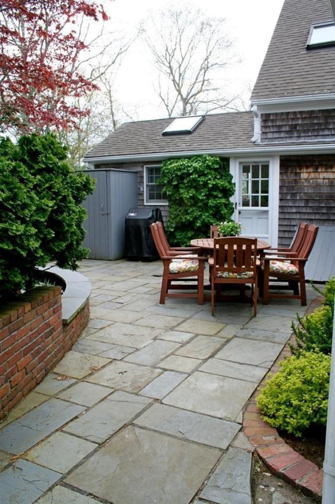 45 Gibson Road Orleans, MA 02653 - Photo 19 of 33 a view of a house with backyard sitting area and garden