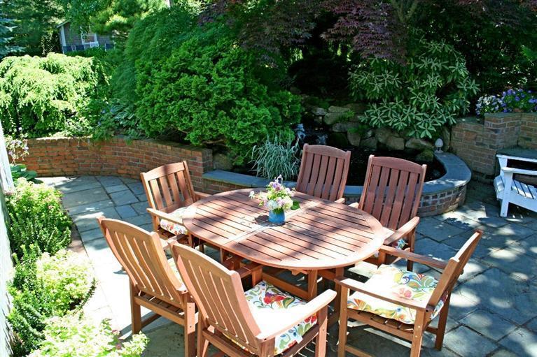 45 Gibson Road Orleans, MA 02653 - Photo 20 of 33 a view of a table and chairs in the patio