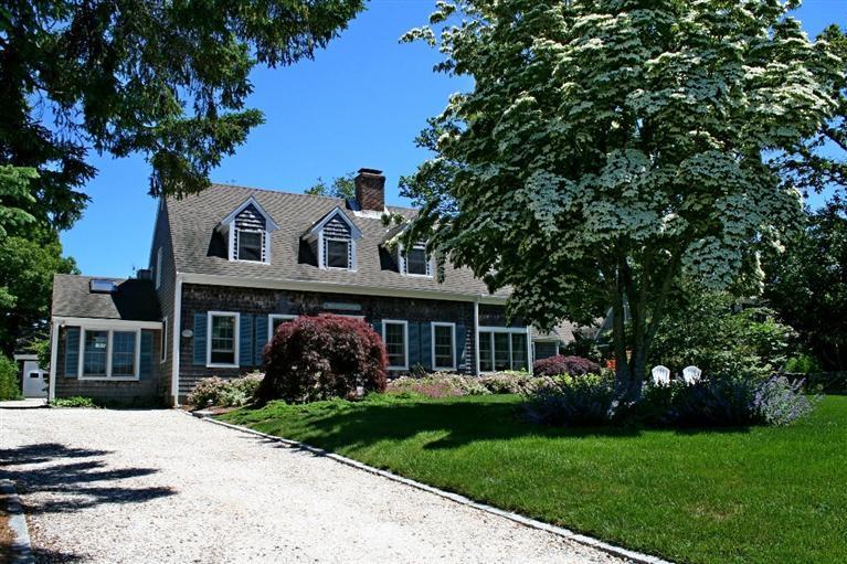 45 Gibson Road Orleans, MA 02653 - Photo 2 of 33 a front view of a house with garden
