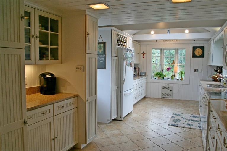 45 Gibson Road Orleans, MA 02653 - Photo 23 of 33 a kitchen with a sink and cabinets