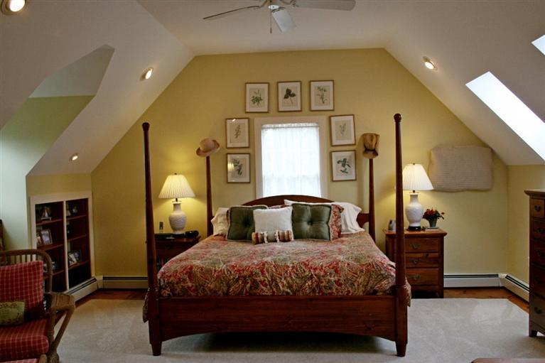 45 Gibson Road Orleans, MA 02653 - Photo 25 of 33 a bedroom with a large bed and a chandelier