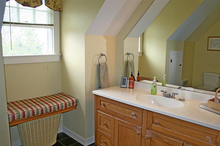 45 Gibson Road Orleans, MA 02653 - Photo 27 of 33 a bathroom with a sink and a mirror