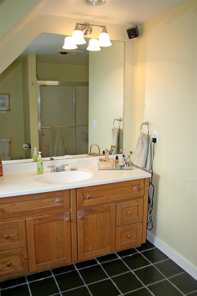 45 Gibson Road Orleans, MA 02653 - Photo 28 of 33 a bathroom with a sink and a mirror