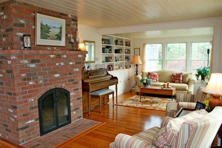 45 Gibson Road Orleans, MA 02653 - Photo 3 of 33 a living room with furniture fireplace and a window