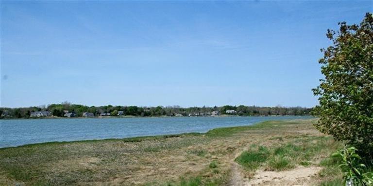 45 Gibson Road Orleans, MA 02653 - Photo 33 of 33 a view of a lake with houses in the back