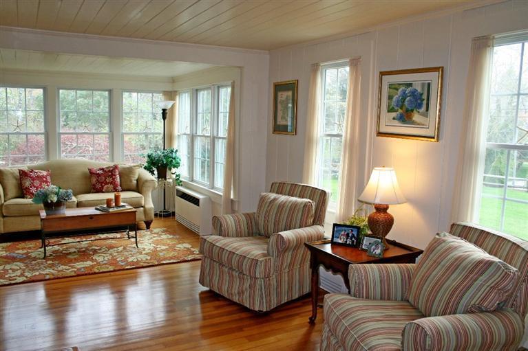 45 Gibson Road Orleans, MA 02653 - Photo 4 of 33 a living room with furniture and a large window