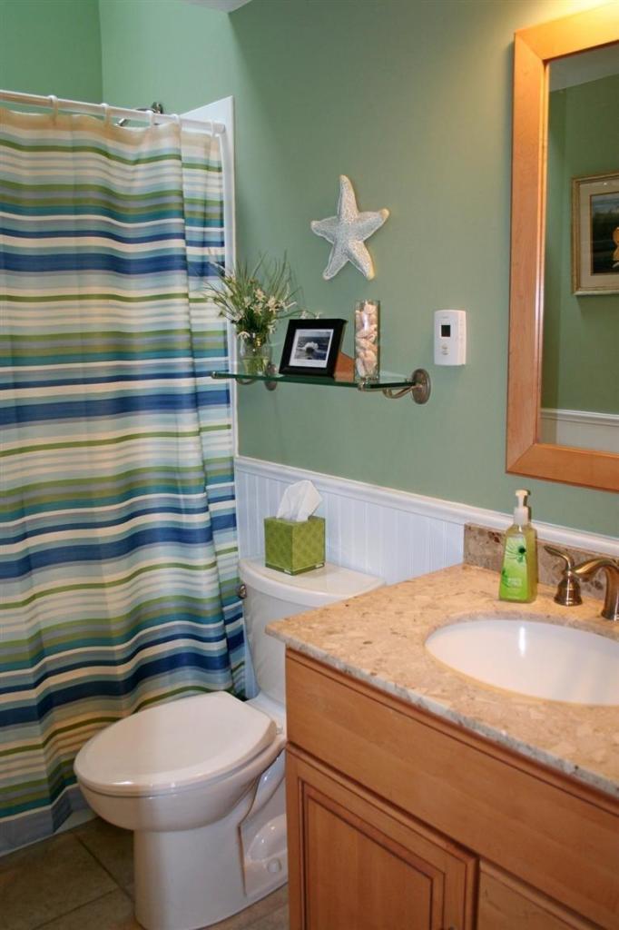 45 Gibson Road Orleans, MA 02653 - Photo 6 of 33 a bathroom with a sink a toilet and a mirror