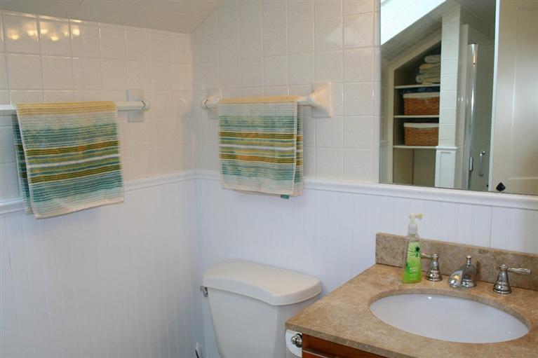 45 Gibson Road Orleans, MA 02653 - Photo 9 of 33 a bathroom with a sink a toilet and a mirror