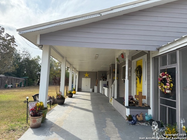 508 East Thornton Street Three Rivers, TX 78071 - Photo 15 of 17 a view of a patio with table and chairs and potted plants