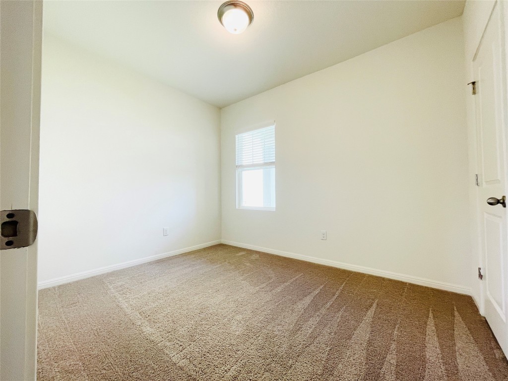 532 Peony Court Jarrell, TX 76537 - Photo 14 of 19 an empty room with a window