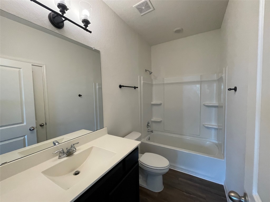 532 Peony Court Jarrell, TX 76537 - Photo 15 of 19 a bathroom with a sink a toilet and shower