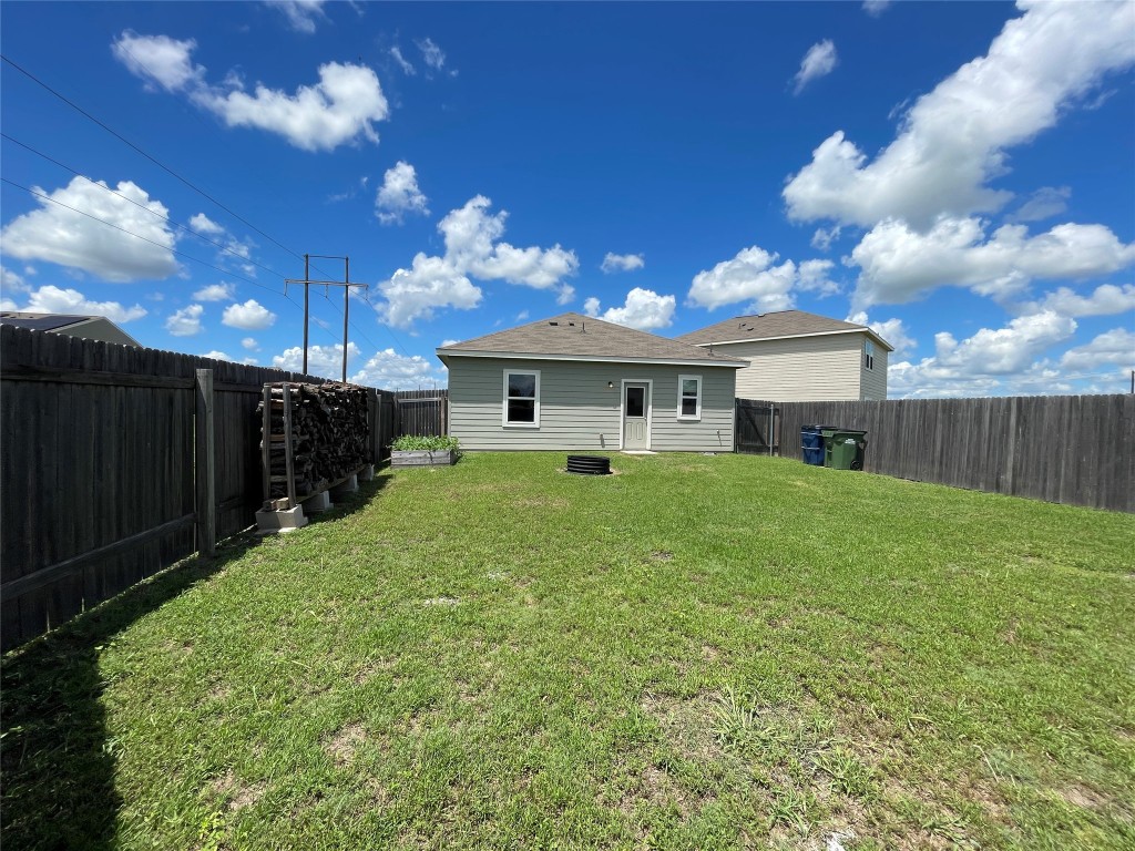 532 Peony Court Jarrell, TX 76537 - Photo 18 of 19 a view of house with yard and entertaining space