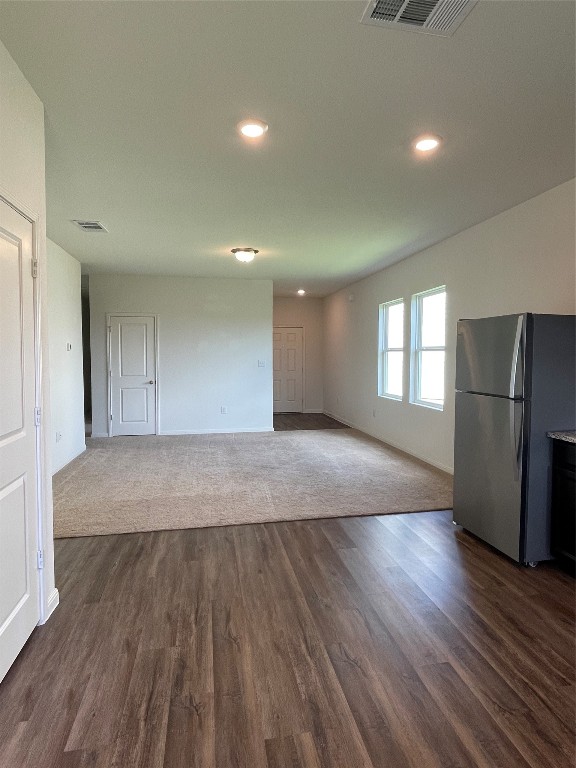 532 Peony Court Jarrell, TX 76537 - Photo 4 of 19 a view of empty room with wooden floor and window