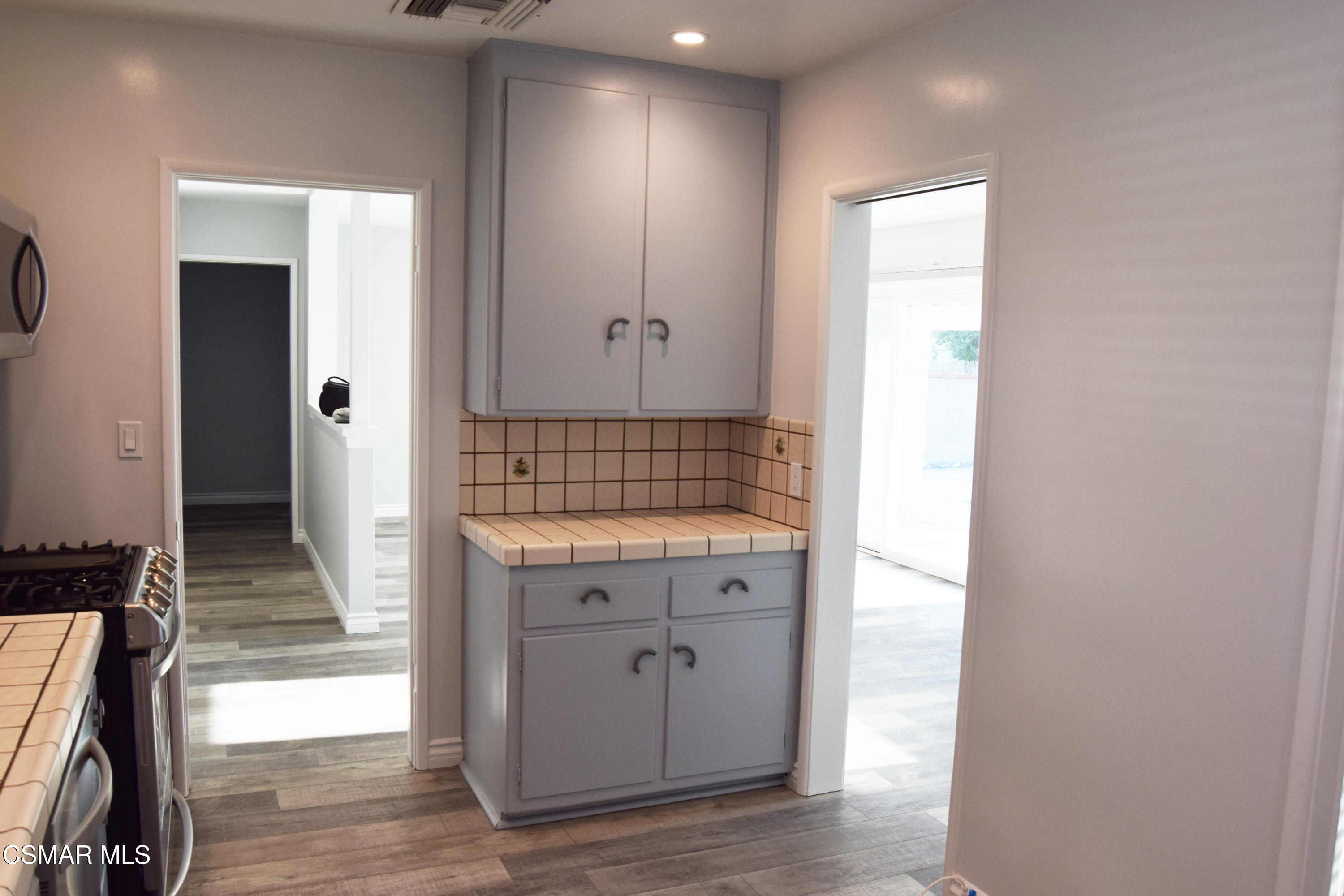 9131 Bartee Avenue Arleta, CA 91331 - Photo 11 of 27 a view of walk in closet with wooden floor