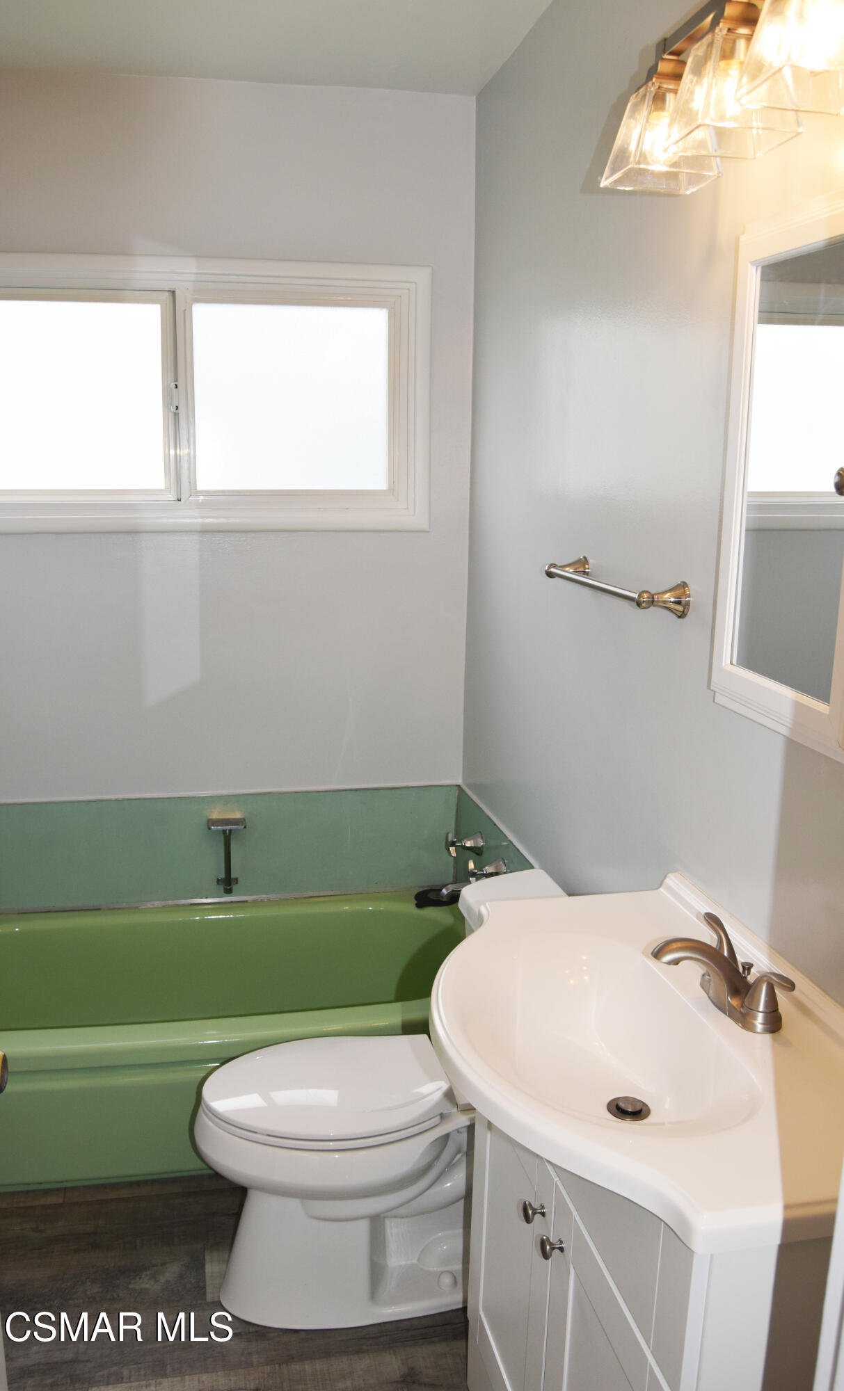 9131 Bartee Avenue Arleta, CA 91331 - Photo 19 of 27 a bathroom with a sink a toilet and a mirror
