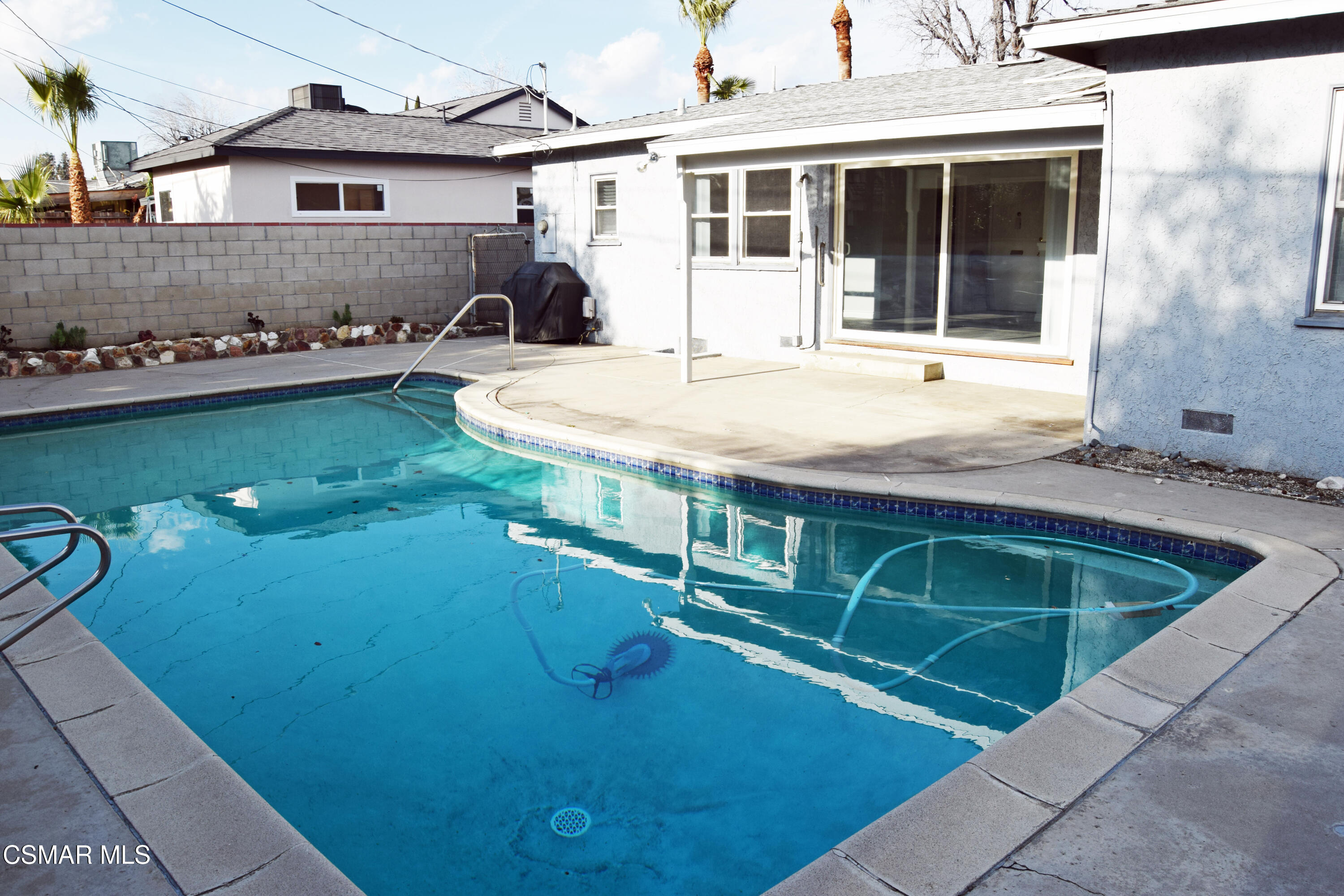 9131 Bartee Avenue Arleta, CA 91331 - Photo 22 of 27 a house view with a swimming pool