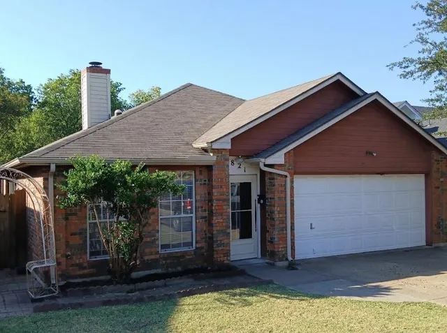 a view of a house with wooden floor and a yard