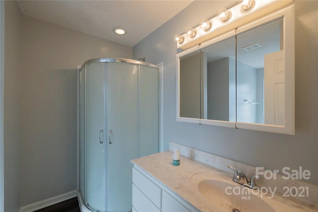 108 Anthony Road Rockwell, NC 28138 - Photo 4 of 21 a bathroom with a sink and a mirror