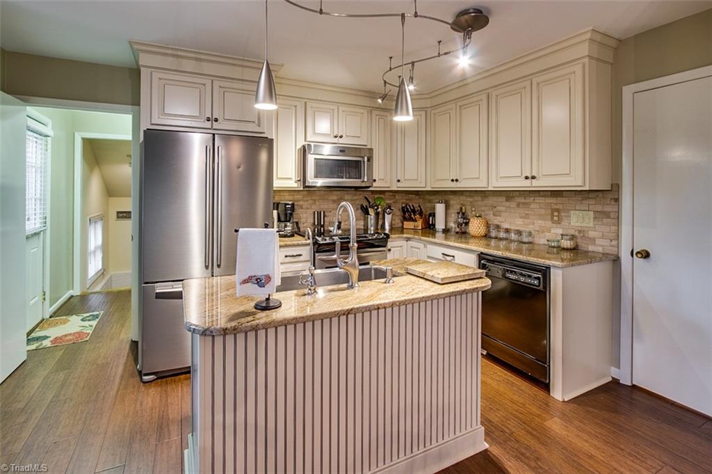 2302 Farmgate Road Browns Summit, NC 27214 - Photo 13 of 30 New cabinets, stainless steel, granite counters.