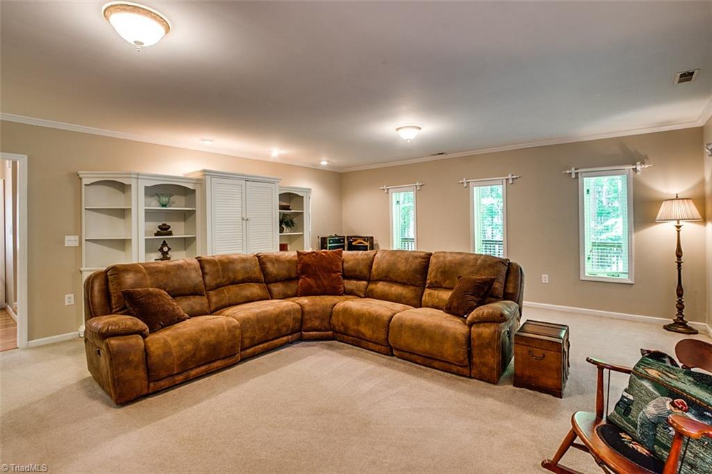 2302 Farmgate Road Browns Summit, NC 27214 - Photo 22 of 30 Spacious Den was once a garage.