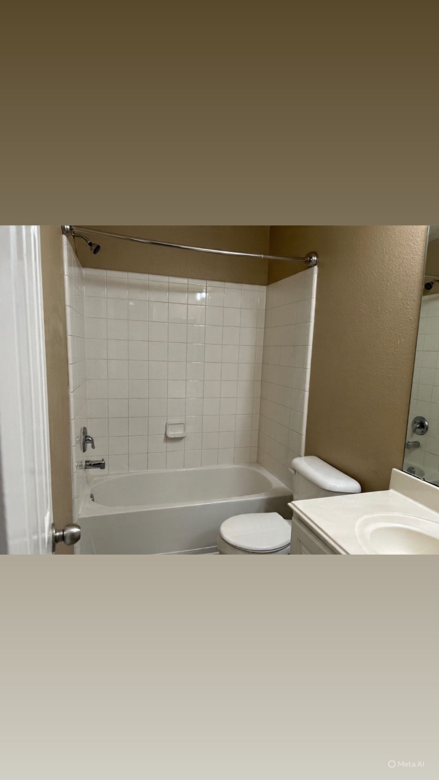 14430 Fairbuff Lane Houston, TX 77014 - Photo 17 of 20 a bathroom with a granite countertop sink and a mirror