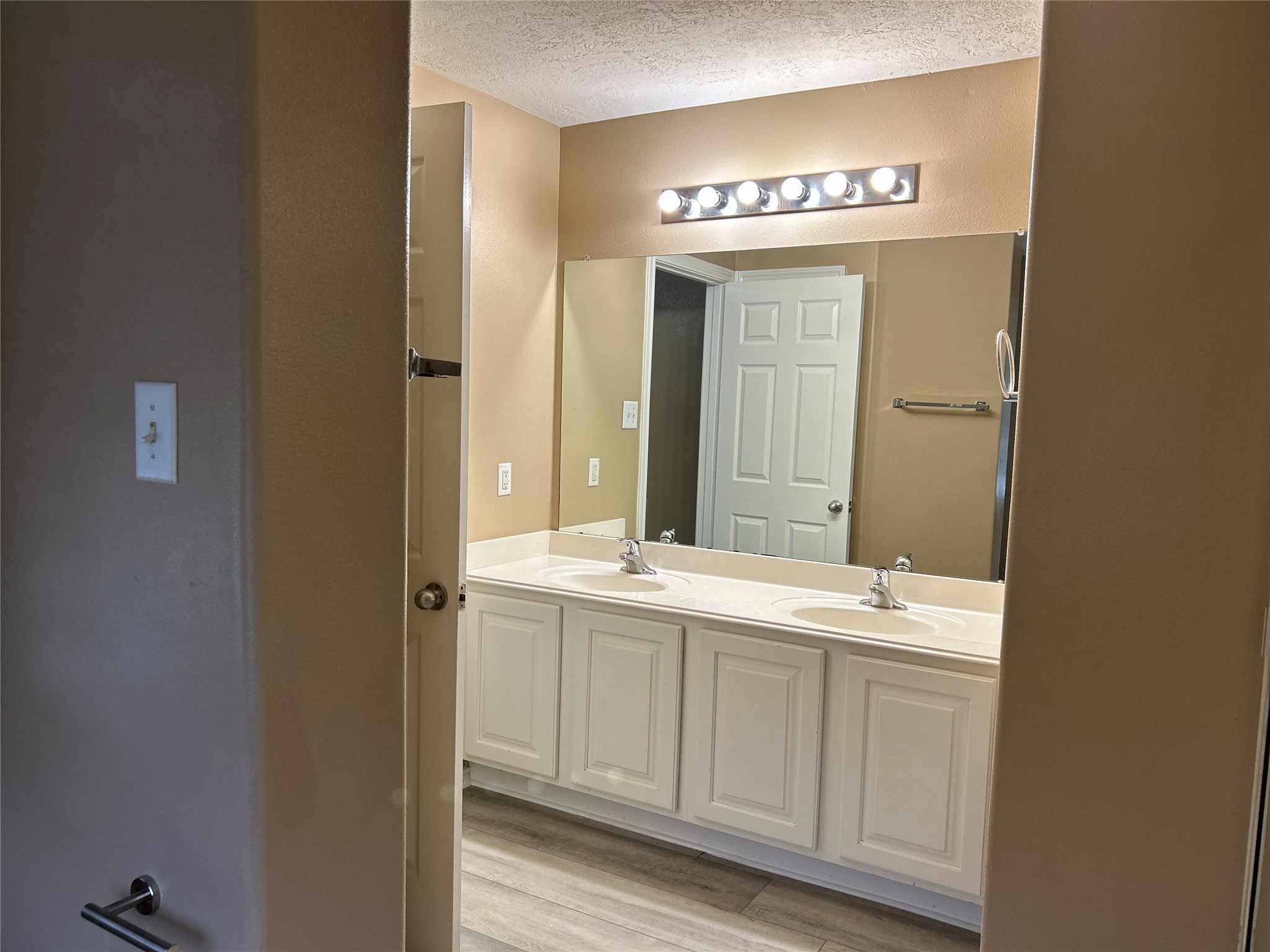 14430 Fairbuff Lane Houston, TX 77014 - Photo 19 of 20 a bathroom with a sink and a mirror