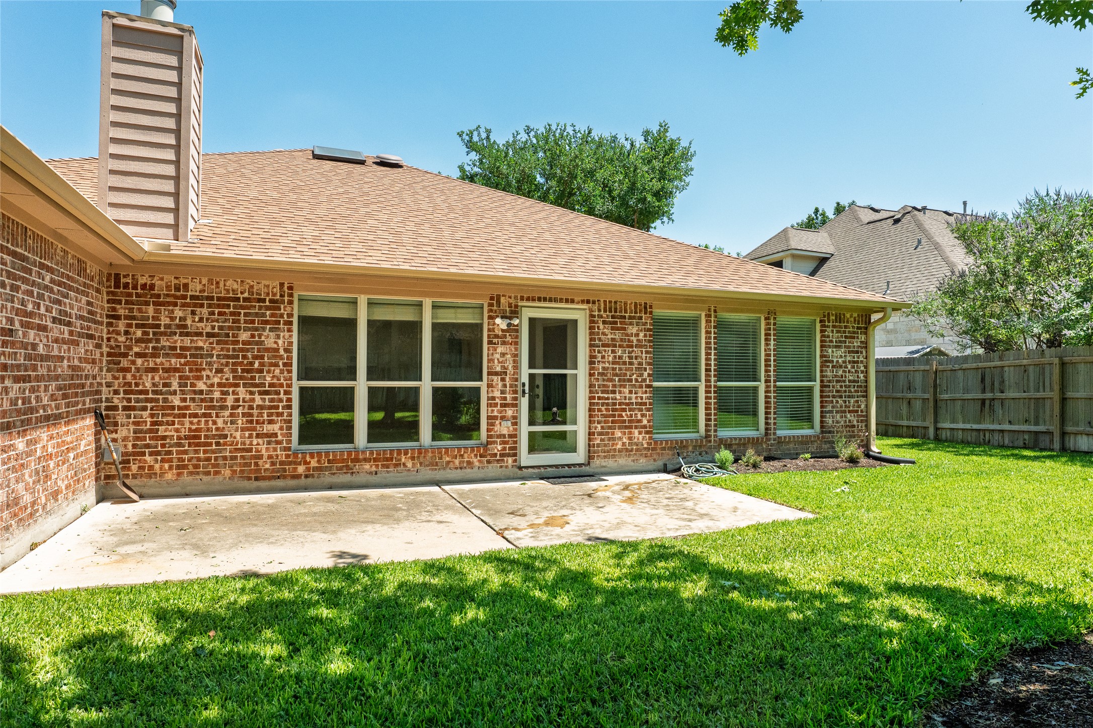 111 Arrowhead Lane Georgetown, TX 78628 - Photo 38 of 40 a front view of a house with a yard and potted plants
