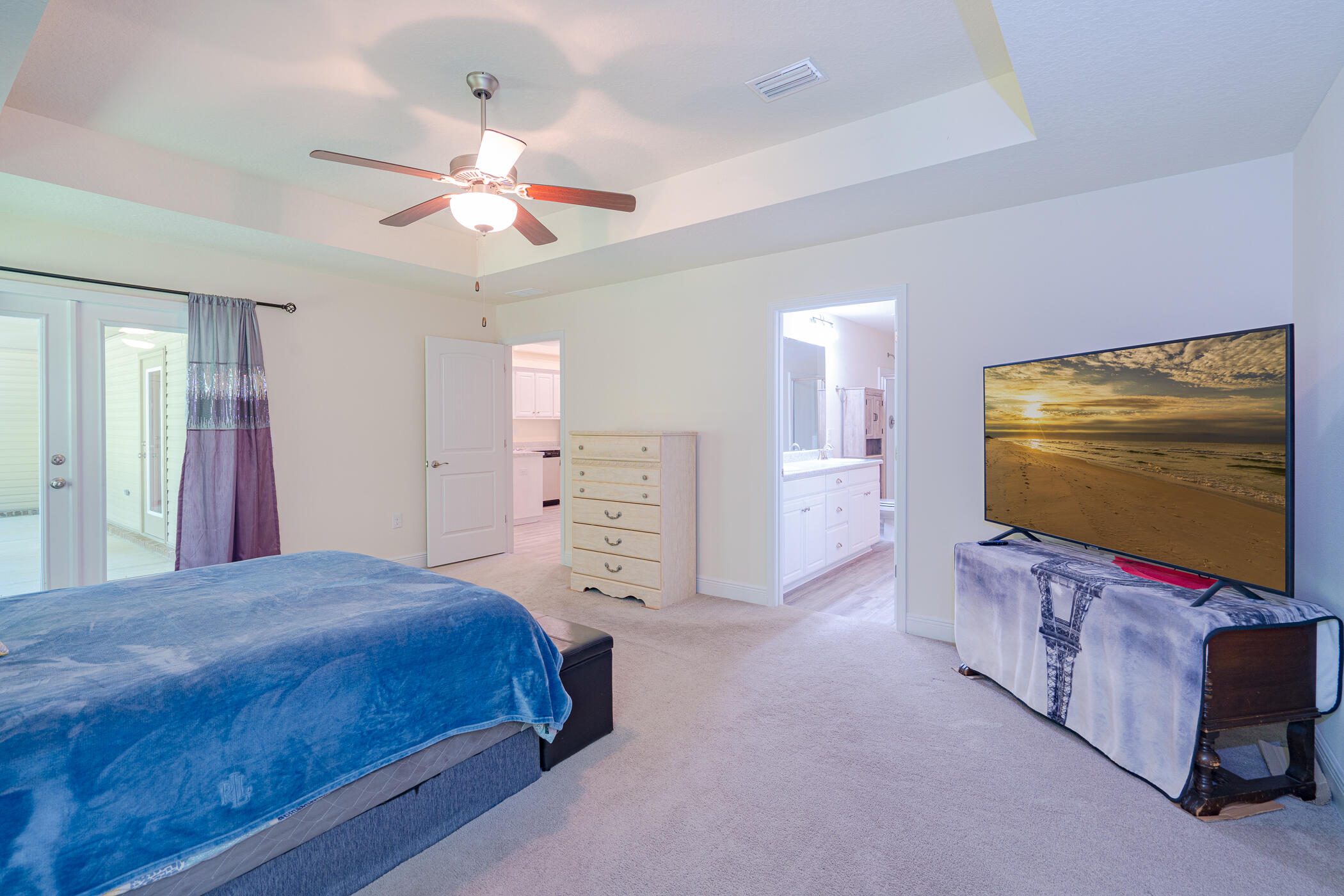 6028 Hidden Valley Road Crestview, FL 32539 - Photo 23 of 45 a bedroom with a bed and a flat screen tv