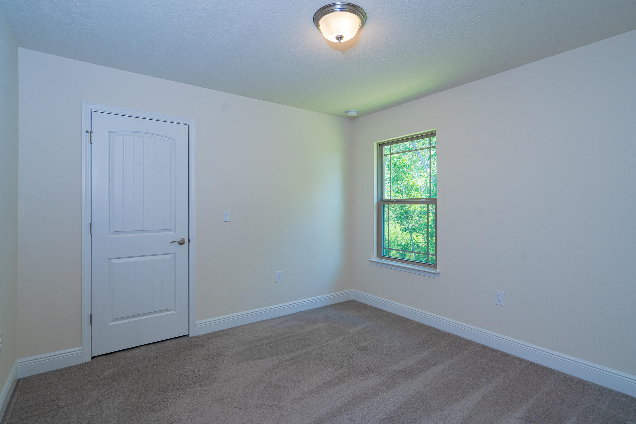 6028 Hidden Valley Road Crestview, FL 32539 - Photo 33 of 45 an empty room with windows