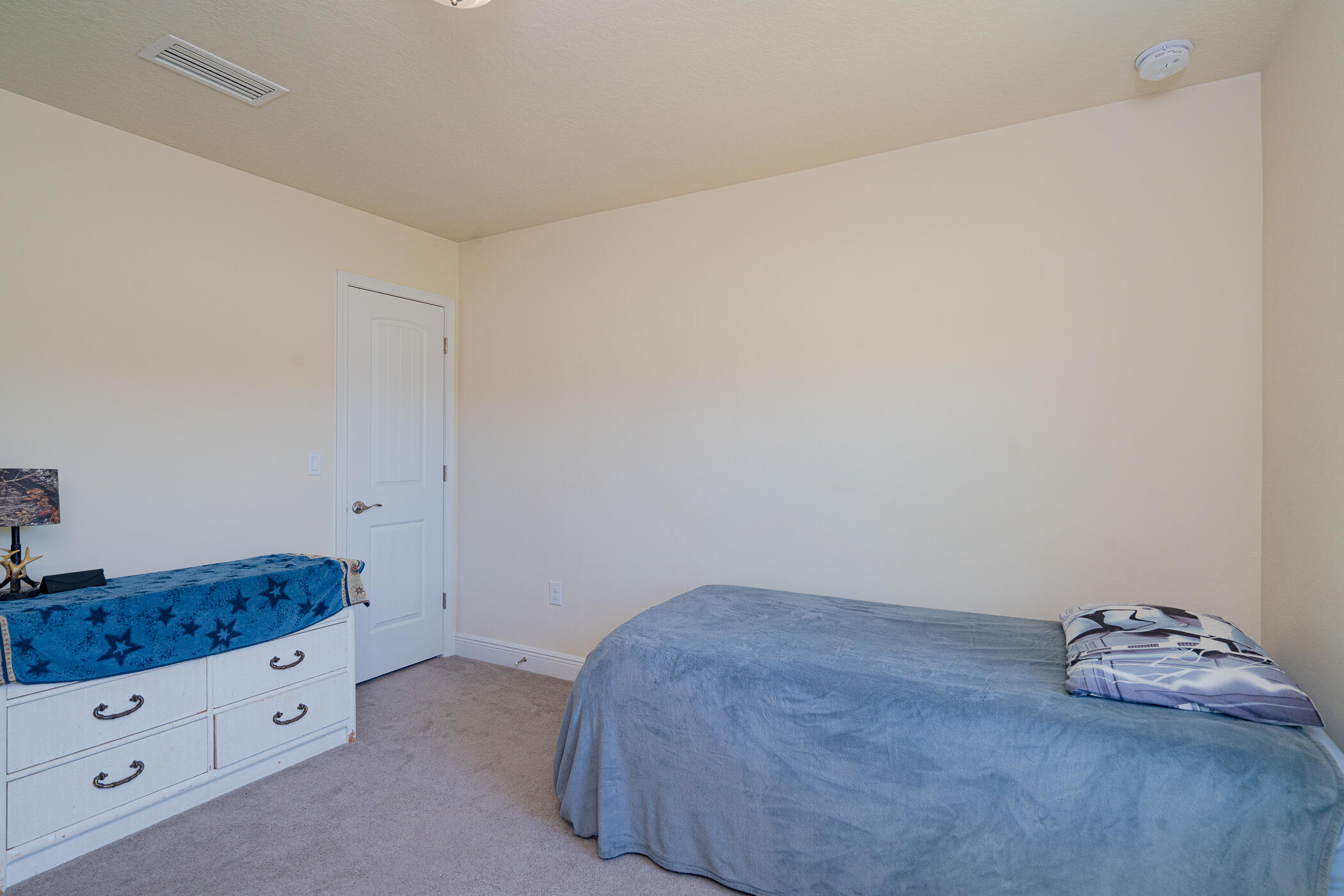 6028 Hidden Valley Road Crestview, FL 32539 - Photo 38 of 45 a room with a bed and storage