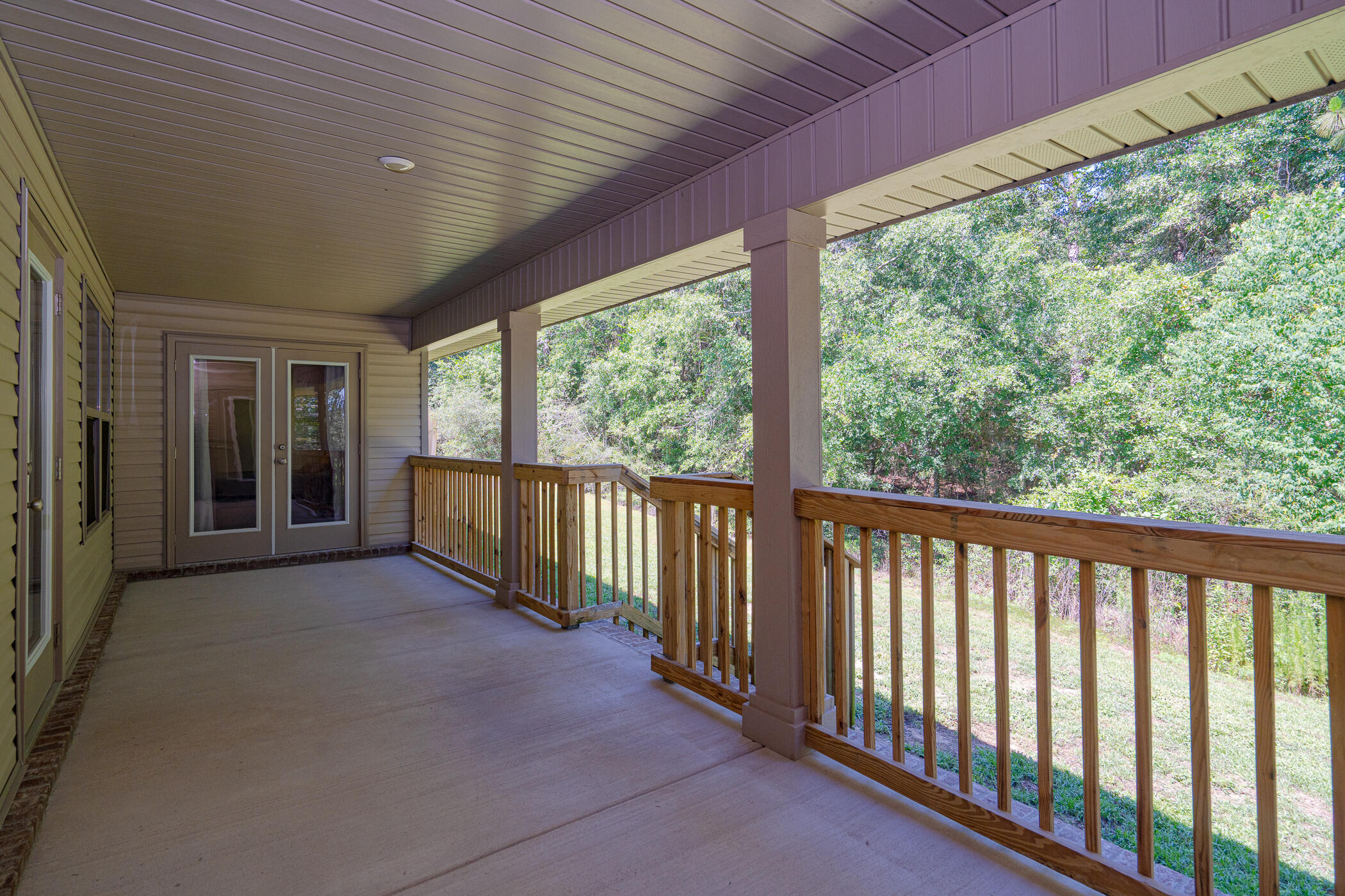 6028 Hidden Valley Road Crestview, FL 32539 - Photo 41 of 45 a view of a porch with wooden floor and outdoor space