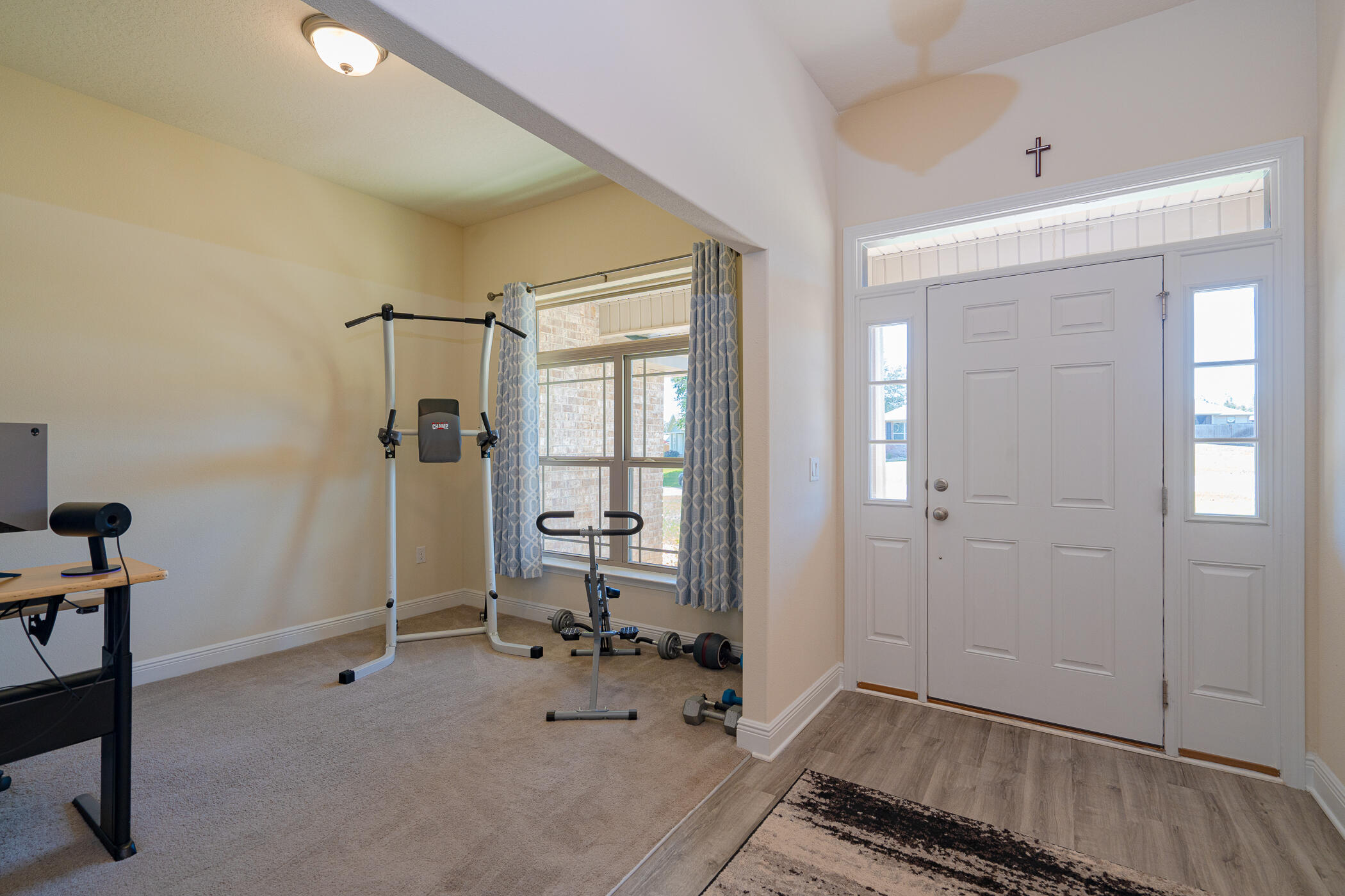 6028 Hidden Valley Road Crestview, FL 32539 - Photo 7 of 45 a very nice looking room with a glass door and furniture