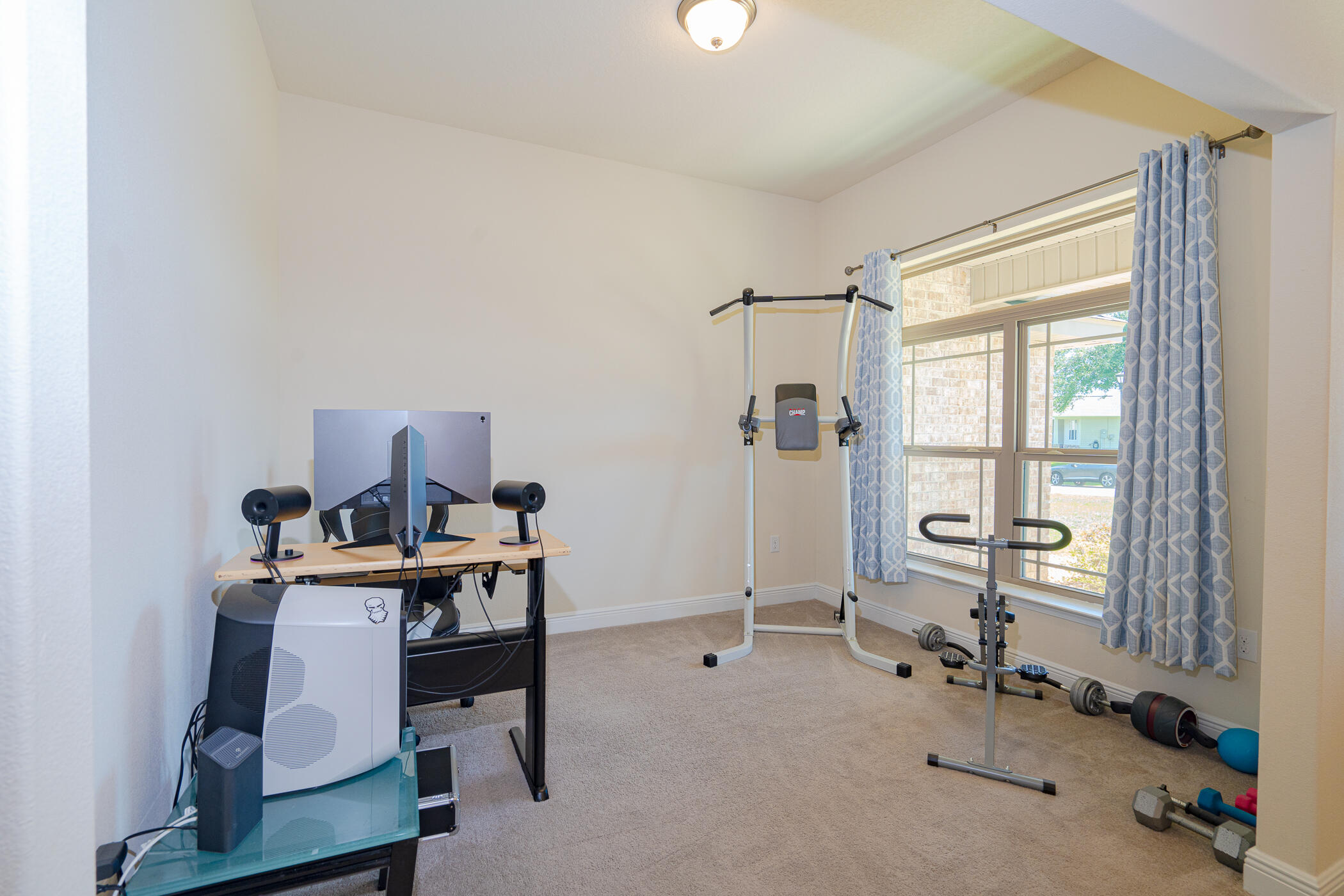6028 Hidden Valley Road Crestview, FL 32539 - Photo 8 of 45 a view of a workspace with furniture and a window