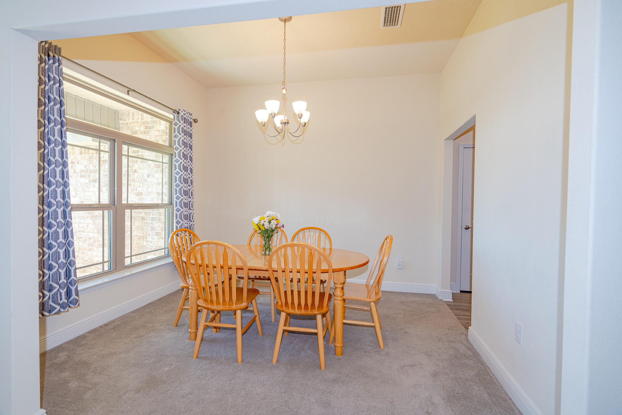 6028 Hidden Valley Road Crestview, FL 32539 - Photo 9 of 45 a dining room with furniture and chandelier kitchen view