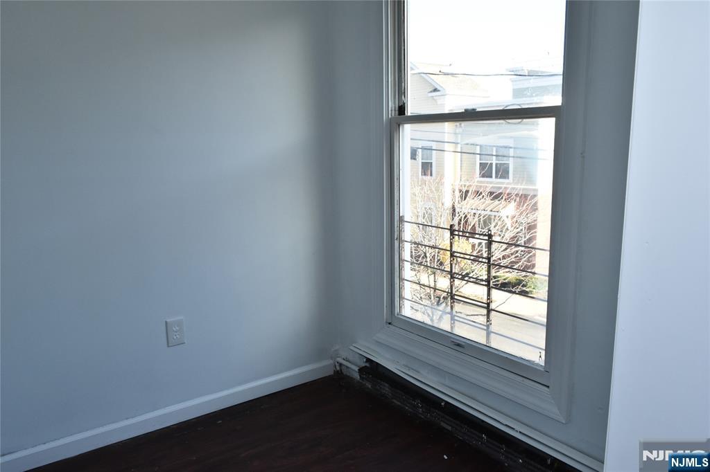 129 Central Place Orange, NJ 07050 - Photo 19 of 28 an empty room with a window