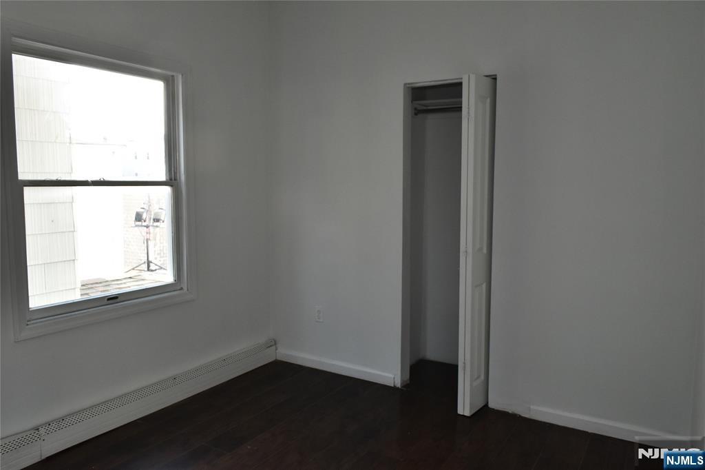 129 Central Place Orange, NJ 07050 - Photo 20 of 28 an empty room with a window