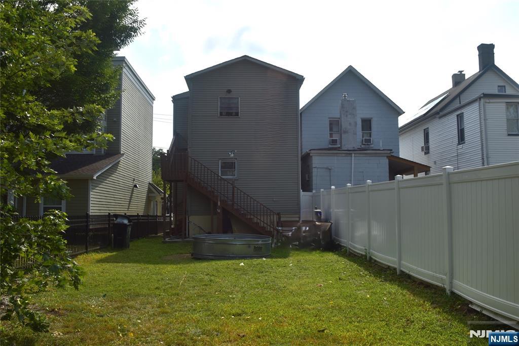 129 Central Place Orange, NJ 07050 - Photo 24 of 28 a view of a back yard of the house
