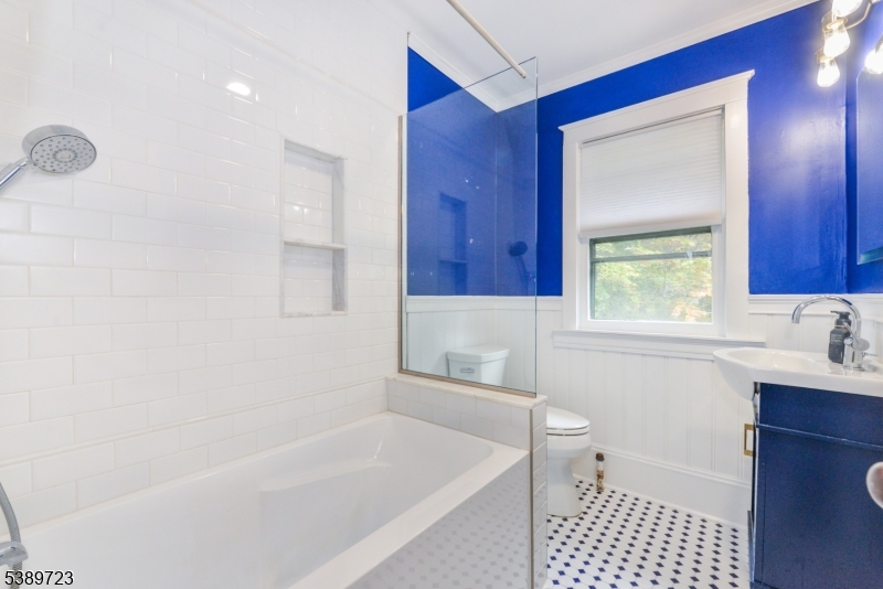 41 Anderson Hill Road Bernardsville, NJ 07924 - Photo 11 of 15 a bathroom with a bathtub a sink a toilet and a window
