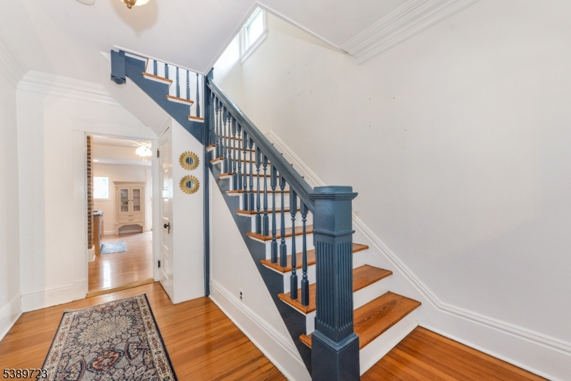 41 Anderson Hill Road Bernardsville, NJ 07924 - Photo 2 of 15 a view of staircase with wooden floor and a rug