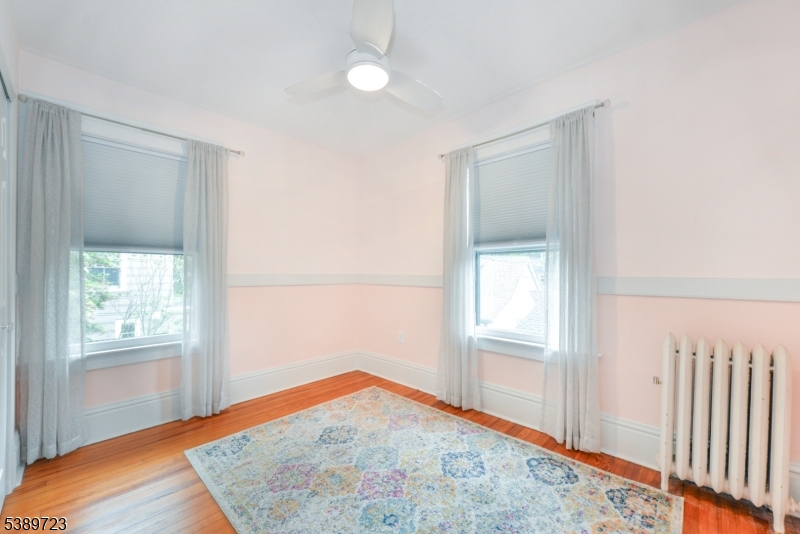41 Anderson Hill Road Bernardsville, NJ 07924 - Photo 10 of 15 a view of empty room with wooden floor and fan