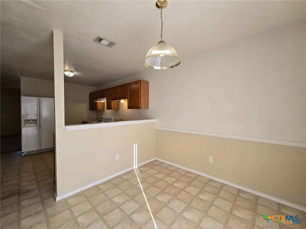 a view of a kitchen with a sink and dishwasher
