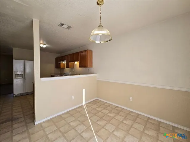 a view of a kitchen with a sink and dishwasher