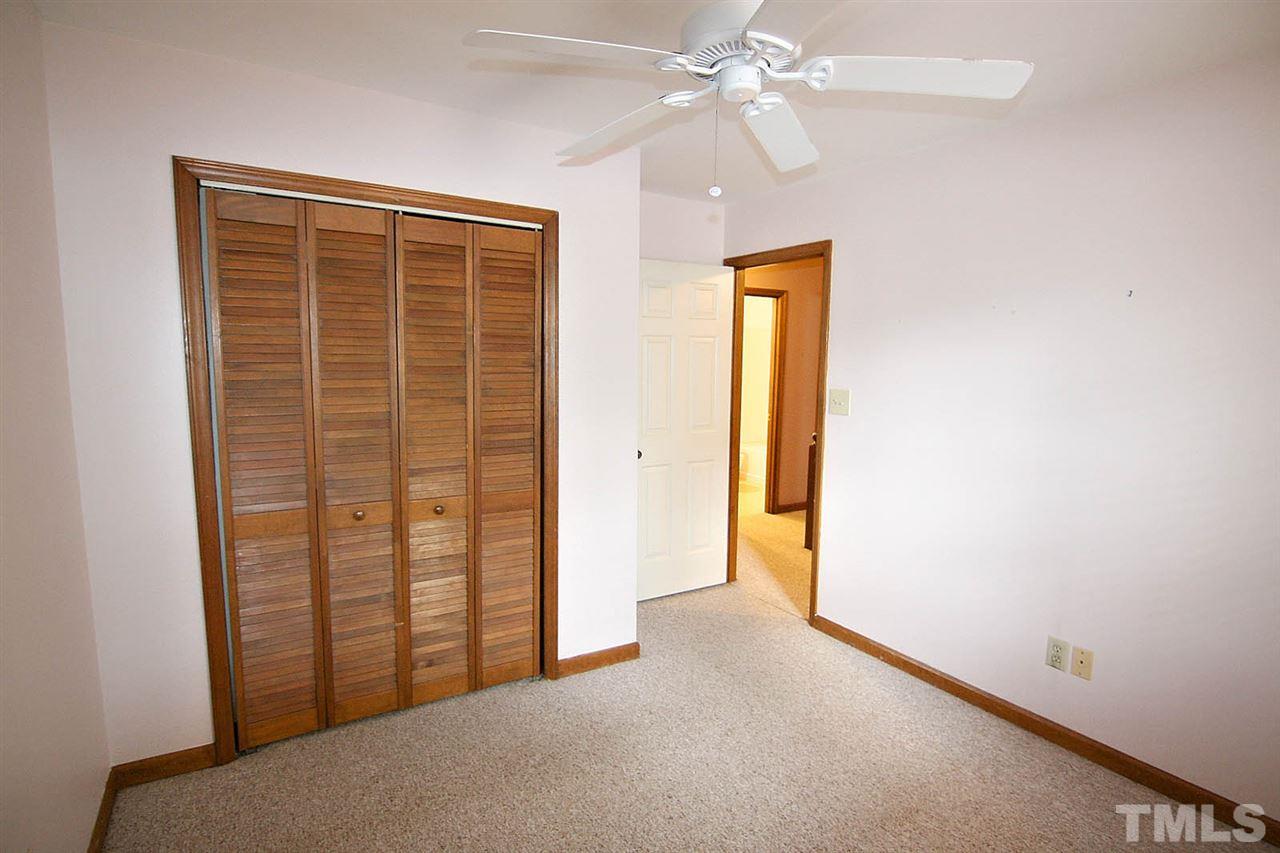 4612 Draper Road Raleigh, NC 27616 - Photo 12 of 16 an empty room with windows and closet